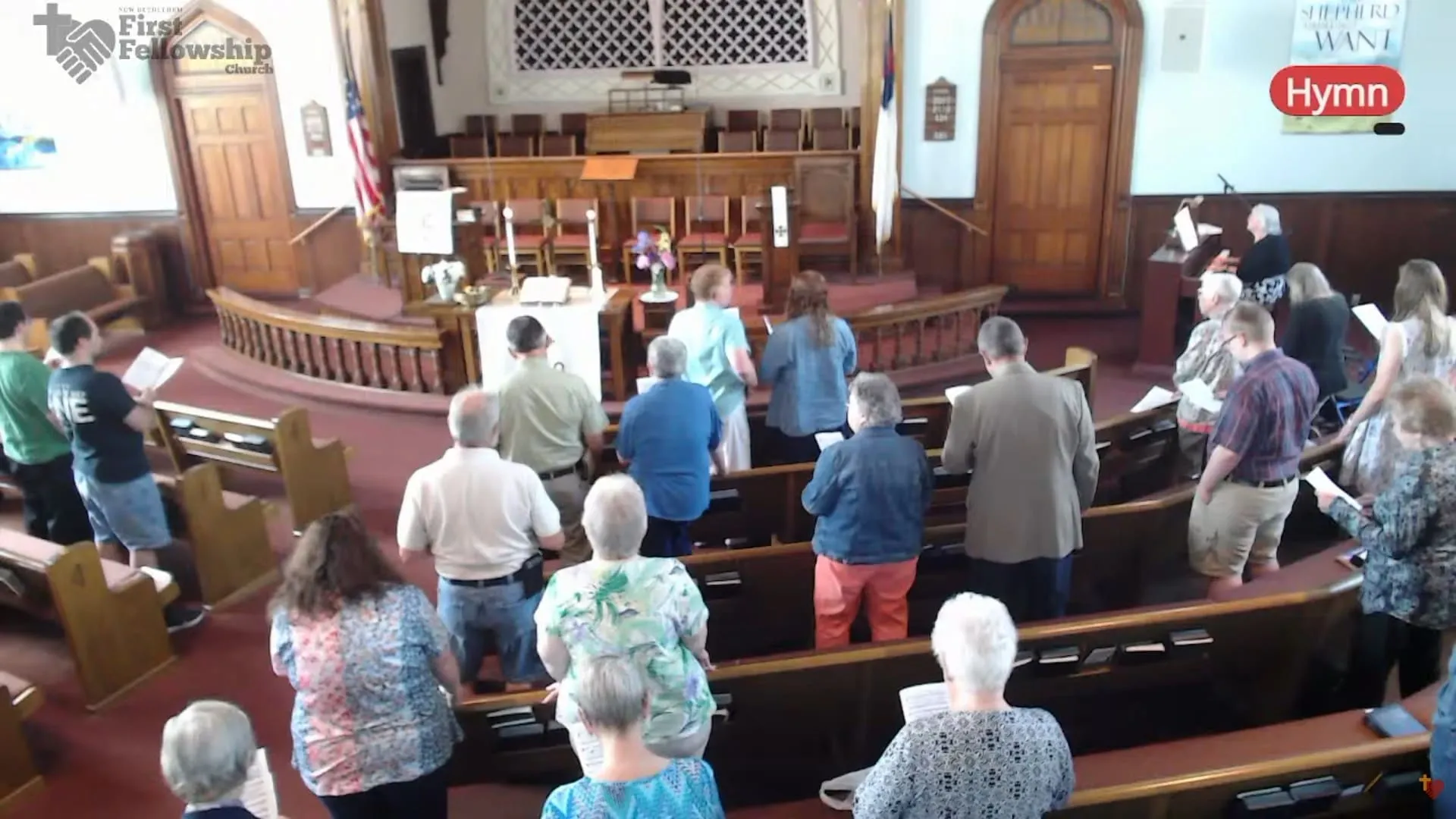 The congregation singing a hymn, as seen on the livestream