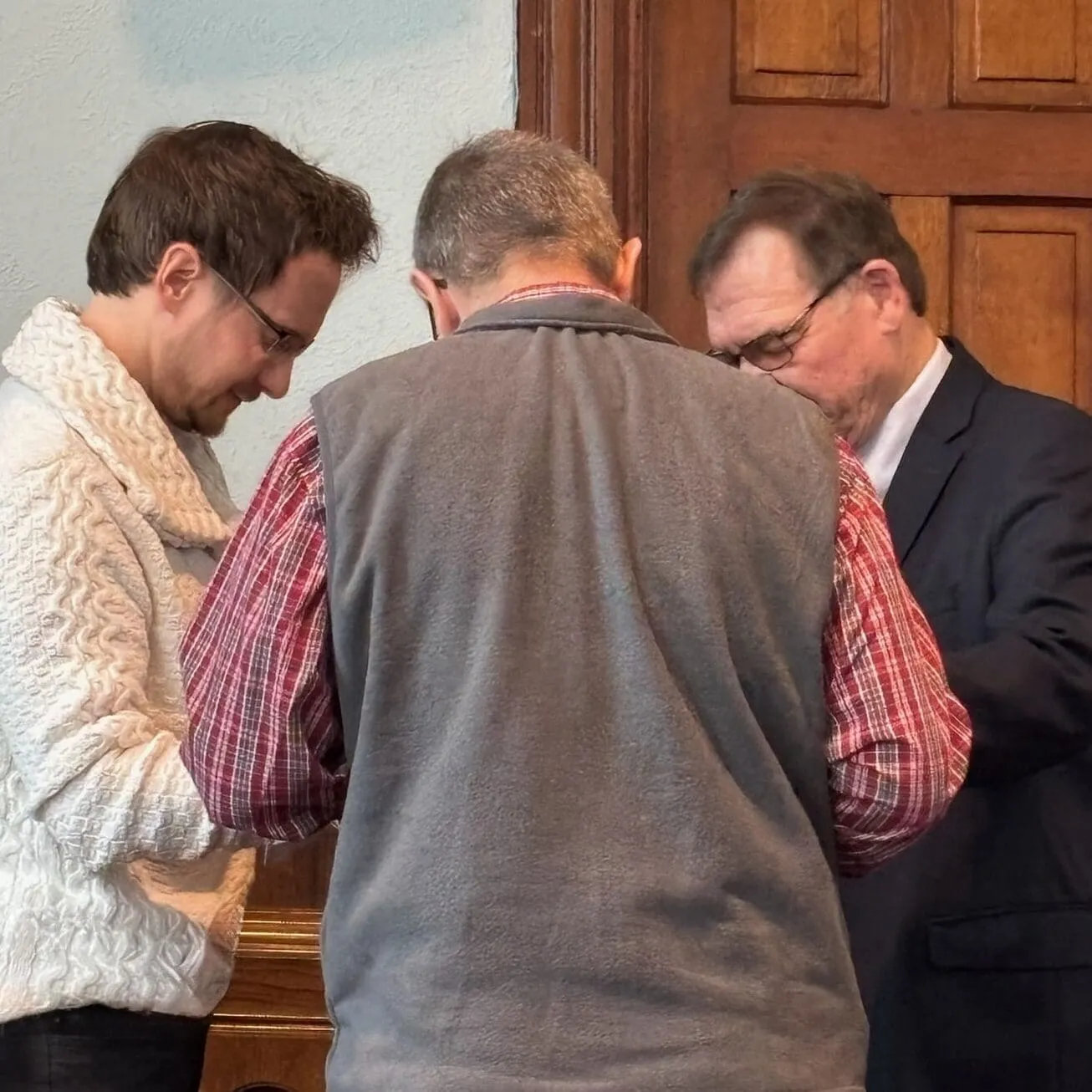 Church members praying together